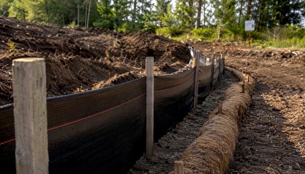 Sediment fence erosion control at clearing site