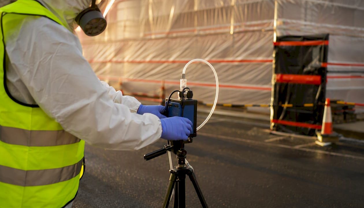 Air monitoring pump near asbestos containment site