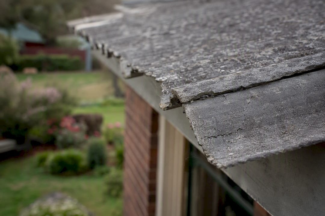 Close-up of cracked asbestos cement eaves