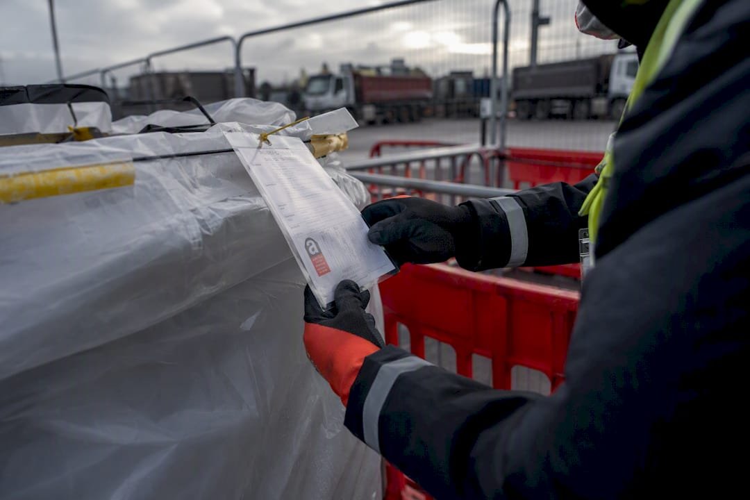 Asbestos waste container with waste manifest tag