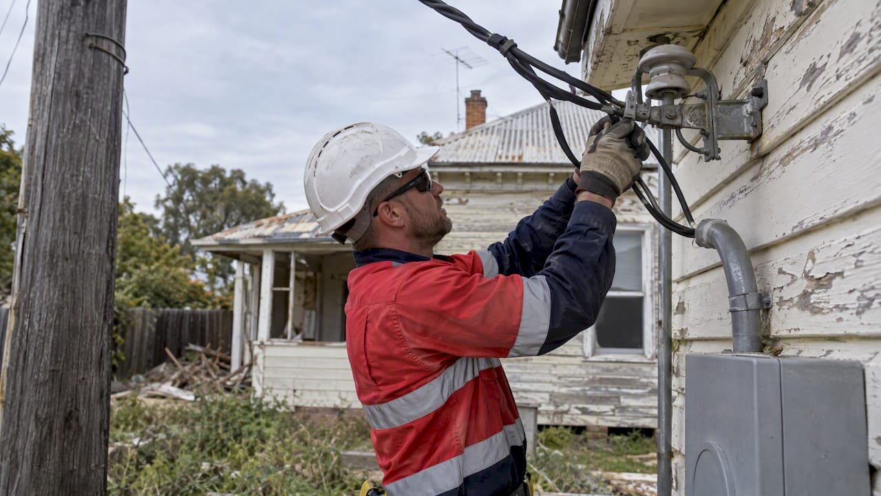 Technician disconnecting a residential service line